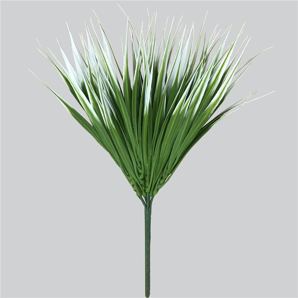 A vibrant White Tipped Grass Stem measuring 35cm, showcasing its UV resistant features, perfect for indoor and outdoor decor.