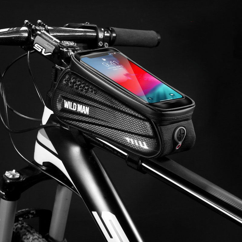 WILD MAN Hard Shell Bicycle Bag mounted on a mountain bike, showcasing its waterproof design and touch screen feature.