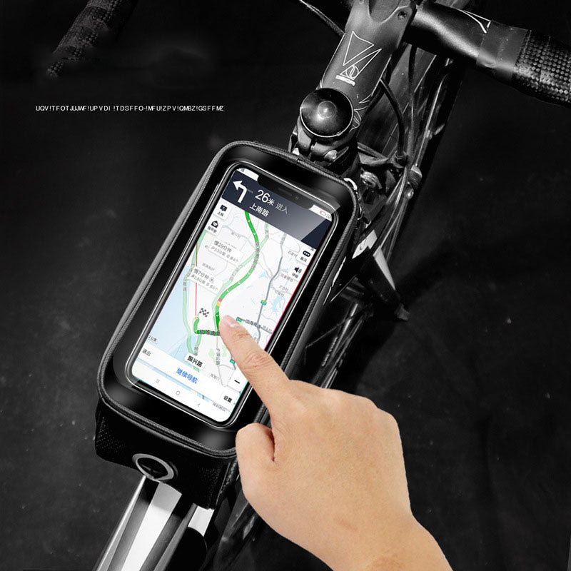 WILD MAN Hard Shell Bicycle Bag mounted on a mountain bike, showcasing its waterproof design and touch screen feature.