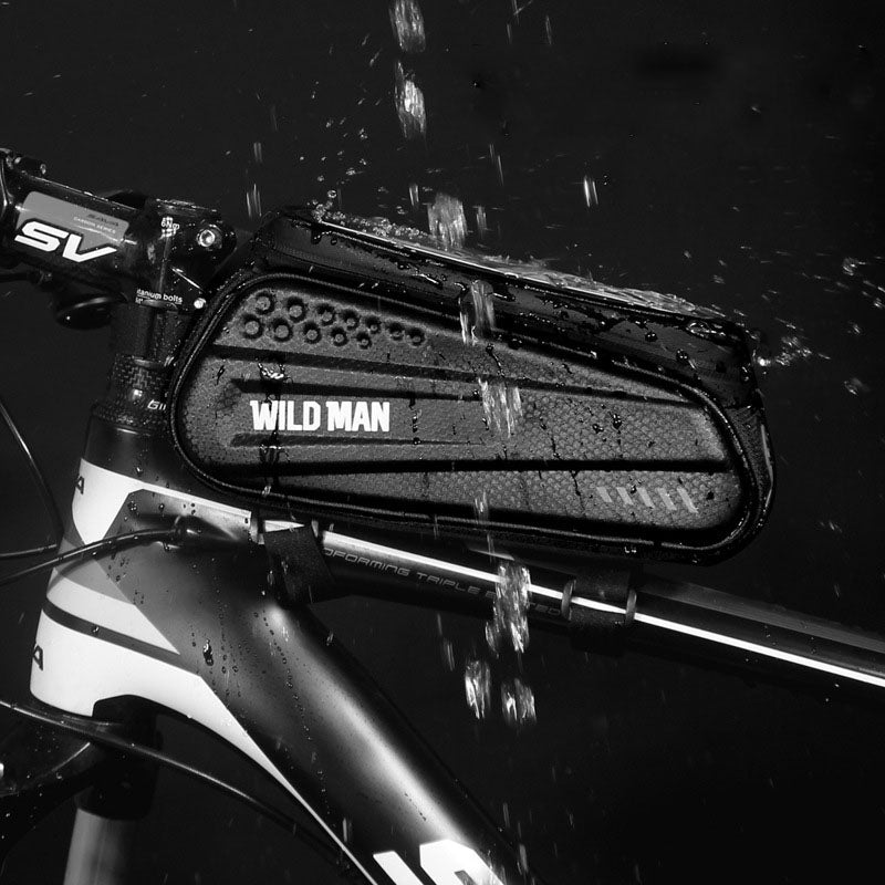 WILD MAN Hard Shell Bicycle Bag mounted on a mountain bike, showcasing its waterproof design and touch screen feature.