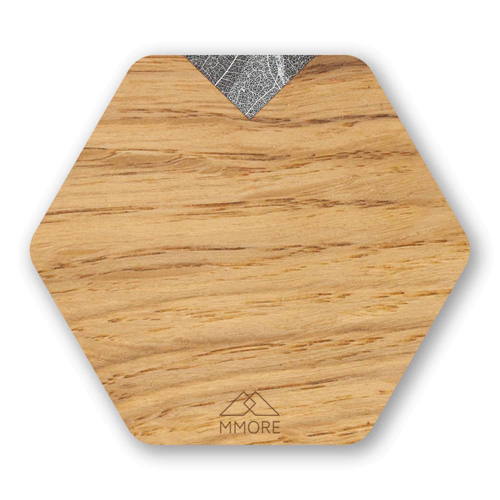 Set of 4 handcrafted wooden coasters made from oak, showcasing unique grain patterns and a modern hexagonal design.