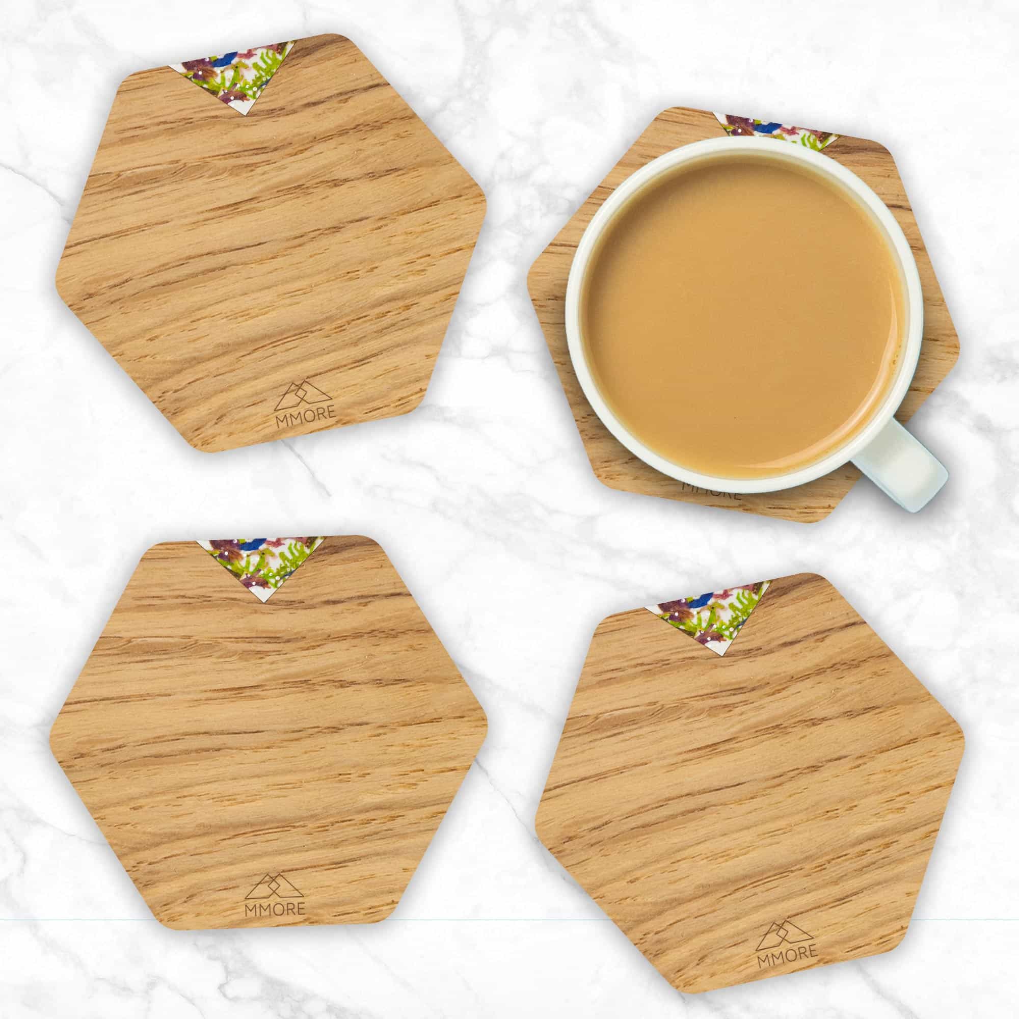 Set of 4 handcrafted wooden coasters made from oak, showcasing unique grain patterns and a modern hexagonal design.