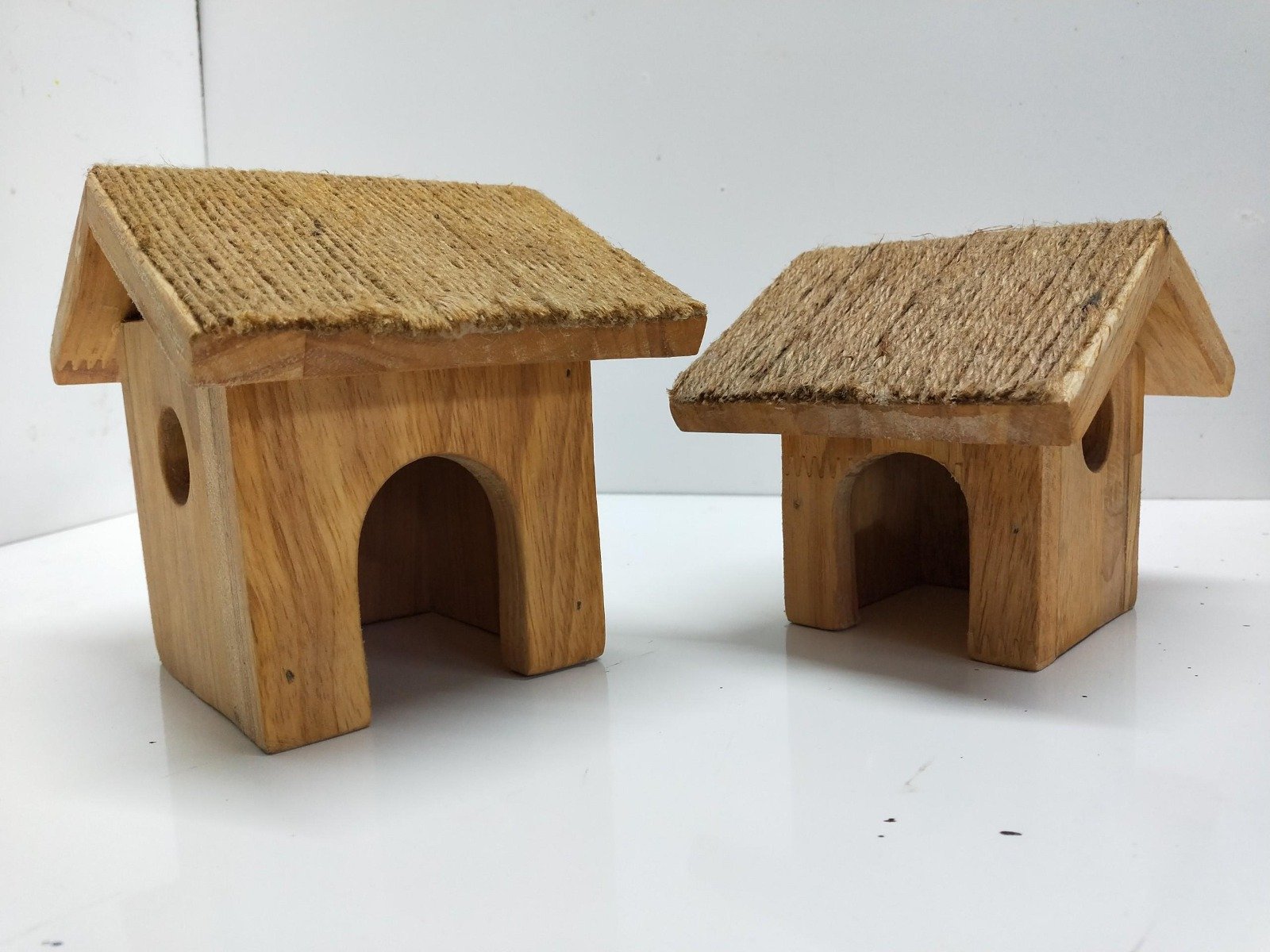 Set of 2 wooden cottages with textured roofs, perfect for home decor.