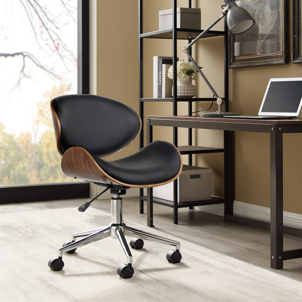 Wooden and PU leather office desk chair in black with a winged back and cushioned seat, featuring a chrome base and castor wheels.