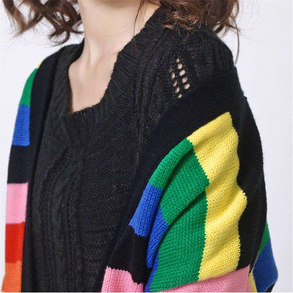 A vibrant Women Rainbow Oversized Cardigan featuring a striped pattern, long sleeves, and a cozy V-neck design, perfect for stylish layering.