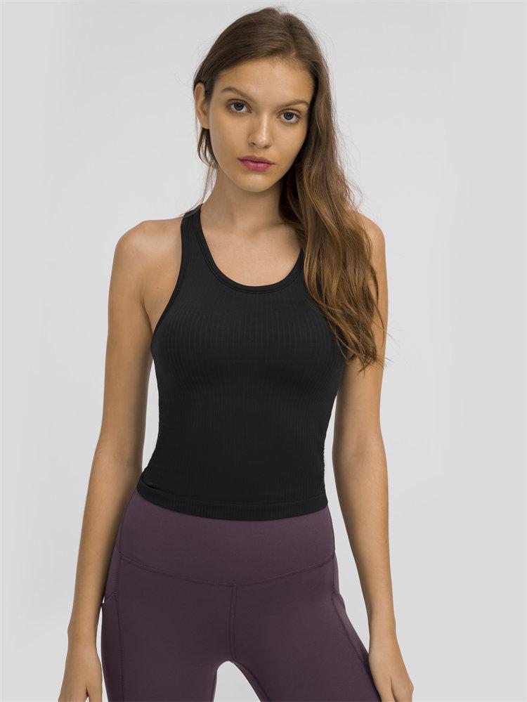 Women wearing a seamless full-length racerback tank top with built-in bra, ideal for workouts and fitness activities.