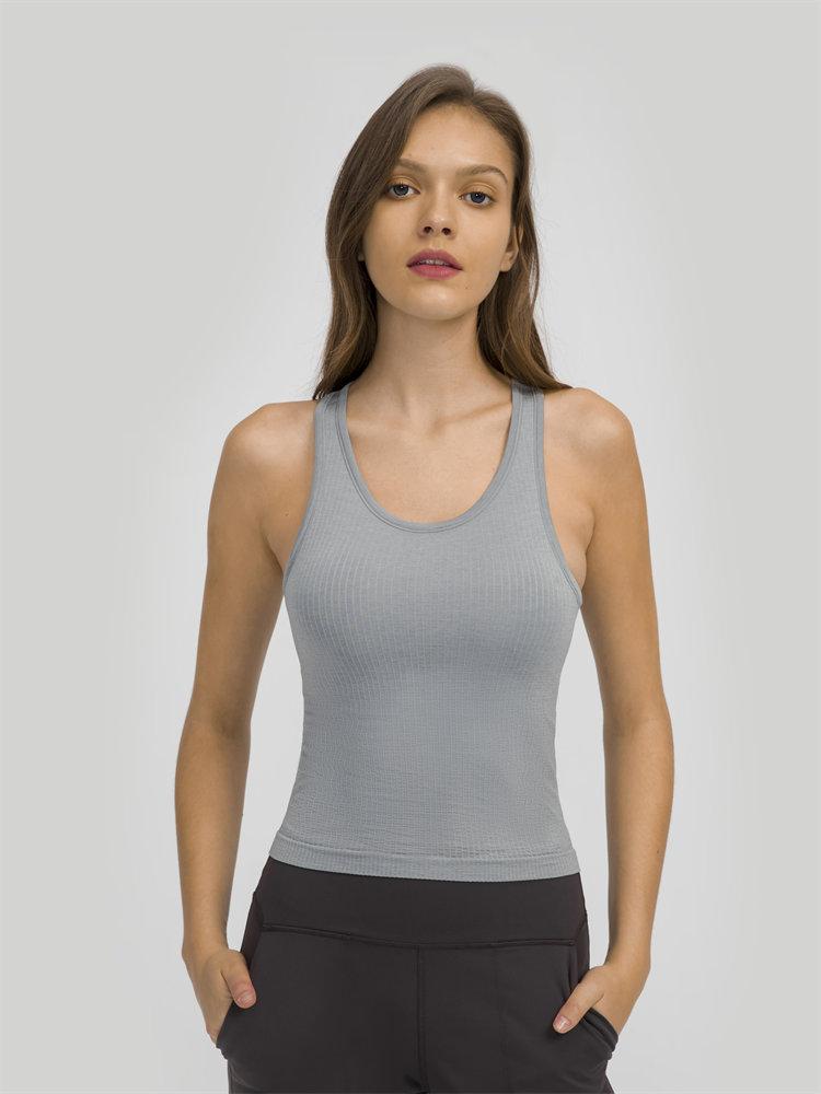 Women wearing a seamless full-length racerback tank top with built-in bra, ideal for workouts and fitness activities.