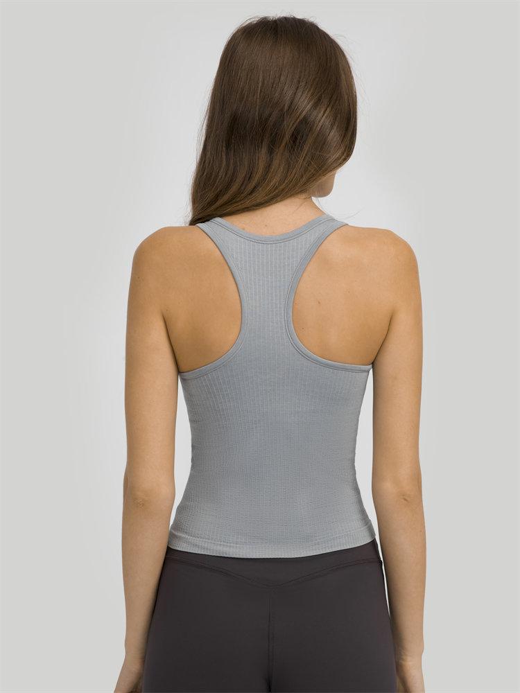 Women wearing a seamless full-length racerback tank top with built-in bra, ideal for workouts and fitness activities.