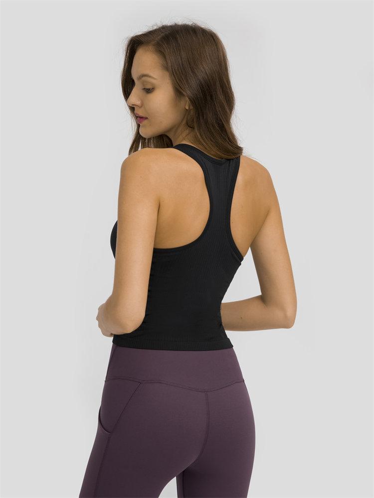 Women wearing a seamless full-length racerback tank top with built-in bra, ideal for workouts and fitness activities.