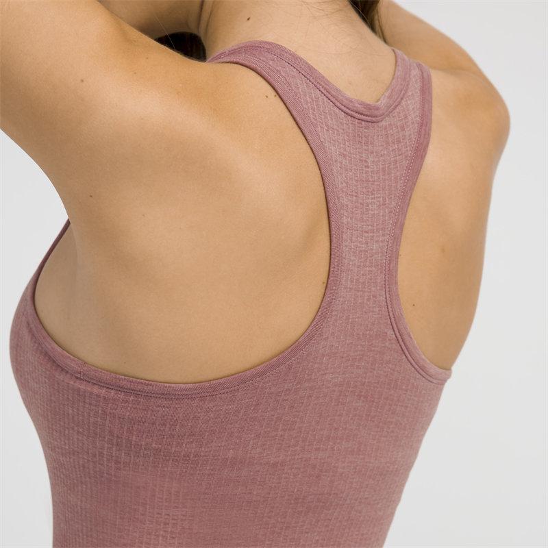 Women wearing a seamless full-length racerback tank top with built-in bra, ideal for workouts and fitness activities.