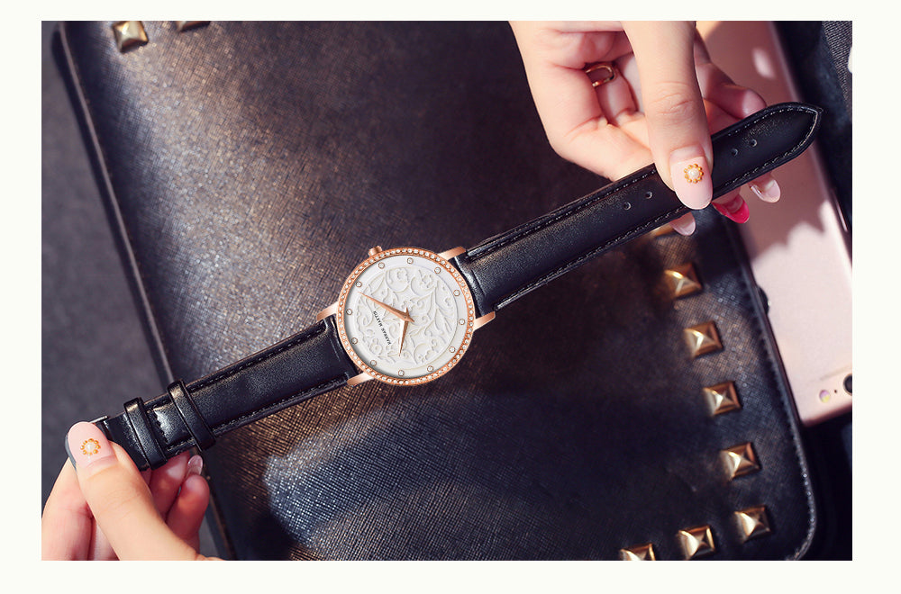 Elegant women's leather wristwatch featuring 3D engraving and Japanese quartz movement, designed for fashion and casual wear.