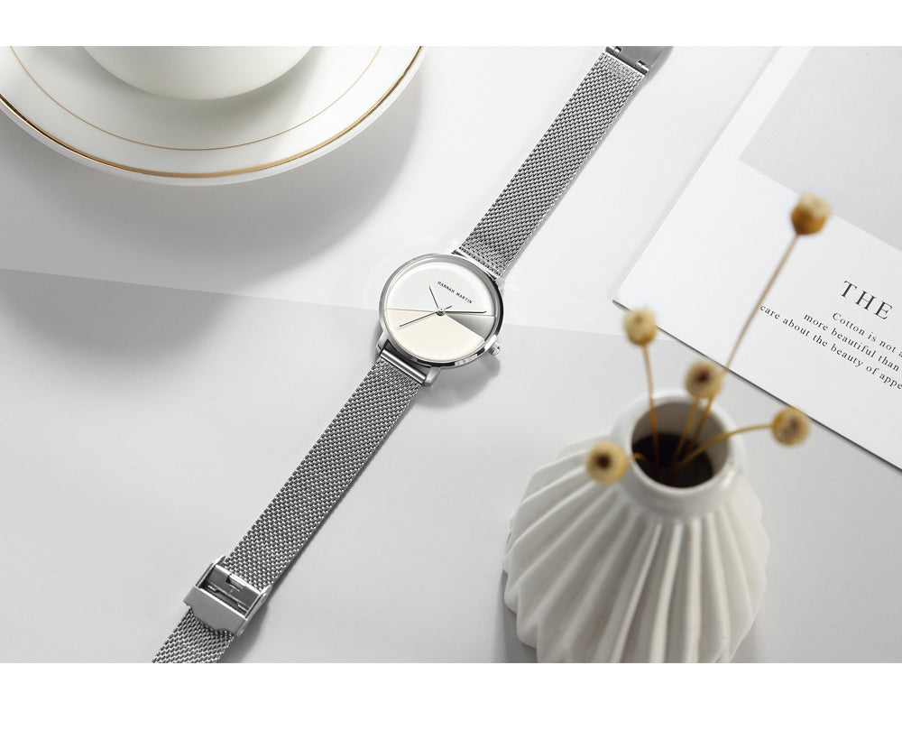 Luxury women's watch featuring Japan Quartz movement and stainless steel band, showcasing a stylish splice dial.