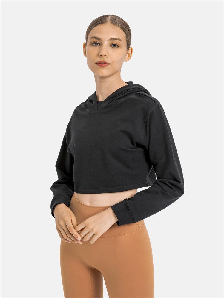 Women wearing a stylish crop hoodie with long sleeves, perfect for workouts and casual outings, showcasing a blend of comfort and fashion.