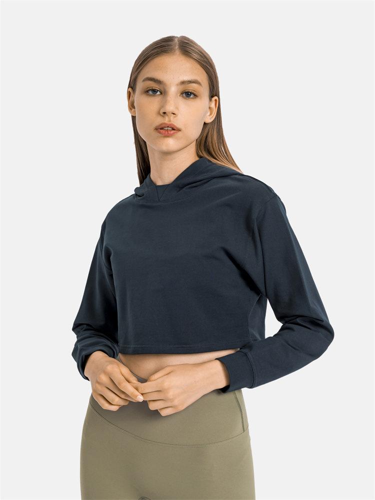 Women wearing a stylish crop hoodie with long sleeves, perfect for workouts and casual outings, showcasing a blend of comfort and fashion.