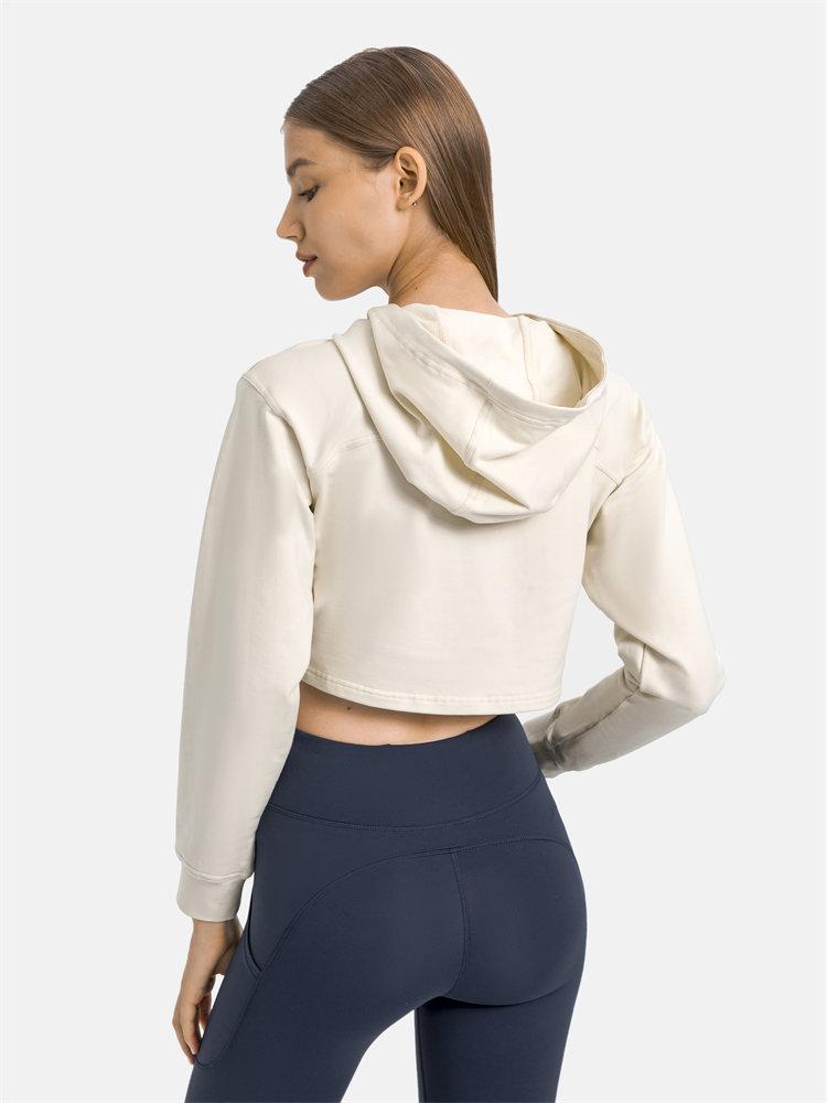 Women wearing a stylish crop hoodie with long sleeves, perfect for workouts and casual outings, showcasing a blend of comfort and fashion.