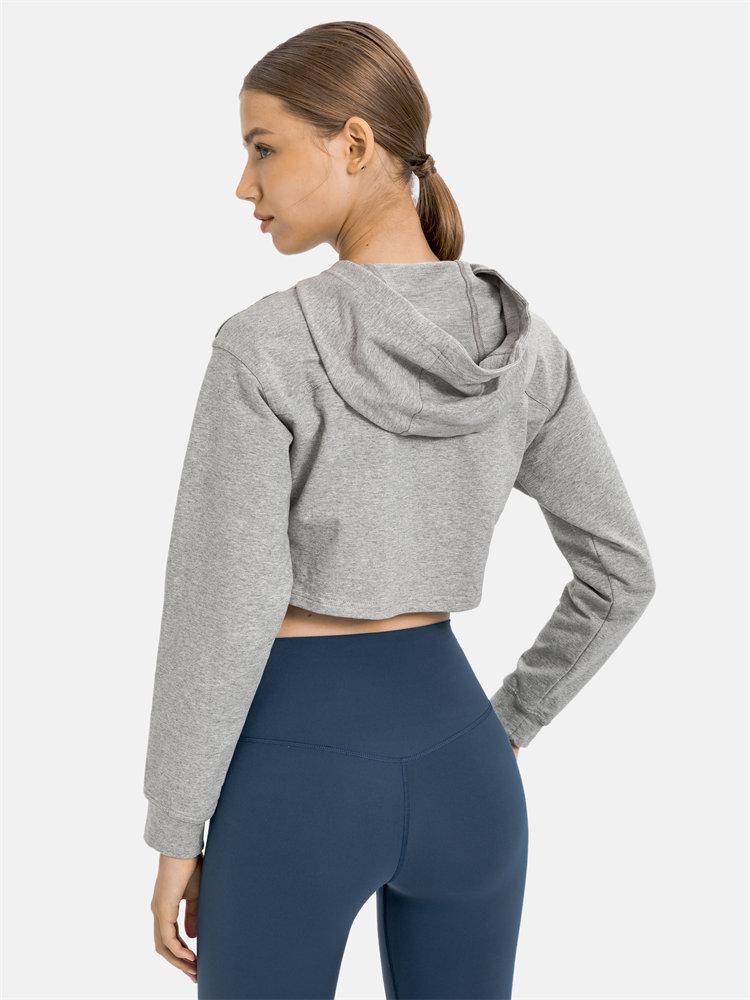 Women wearing a stylish crop hoodie with long sleeves, perfect for workouts and casual outings, showcasing a blend of comfort and fashion.