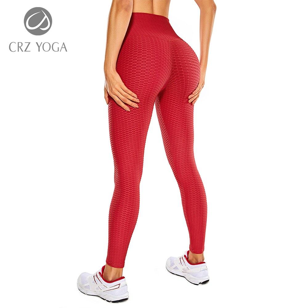 Women's high waisted compression running yoga pants with textured design and pocket, perfect for workouts.