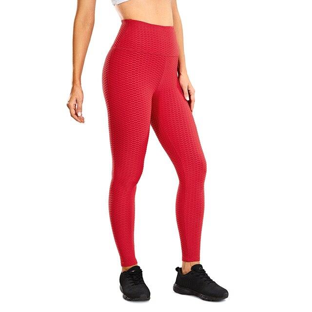 Women's high waisted compression running yoga pants with textured design and pocket, perfect for workouts.