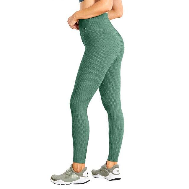 Women's high waisted compression running yoga pants with textured design and pocket, perfect for workouts.