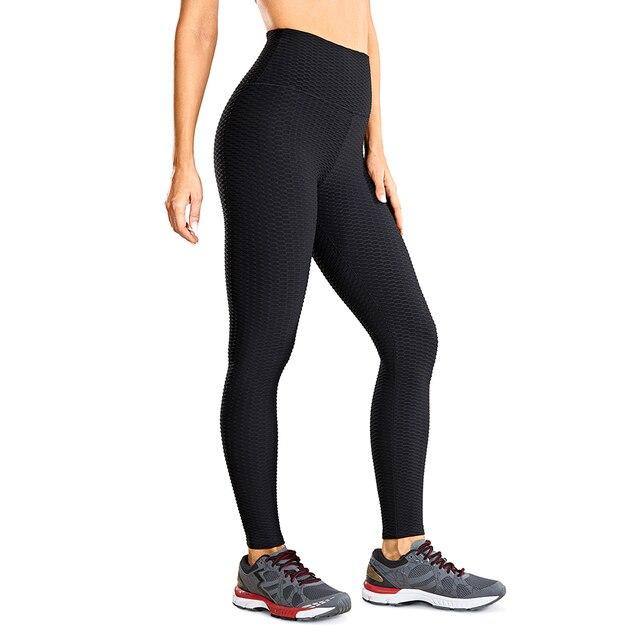 Women's high waisted compression running yoga pants with textured design and pocket, perfect for workouts.