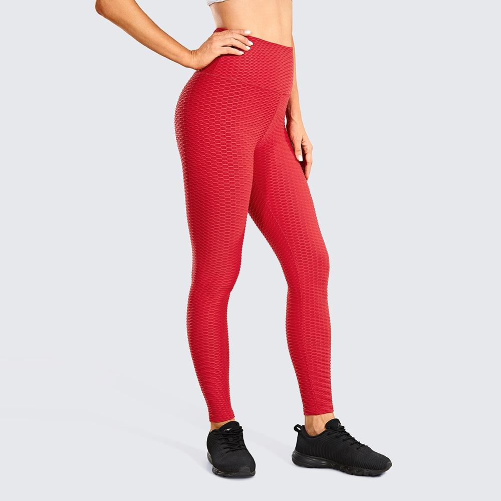 Women's high waisted compression running yoga pants with textured design and pocket, perfect for workouts.