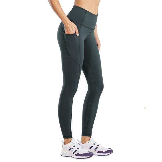 Women's Hugged Feeling Training Leggings in black, featuring a compression fit, tummy control, and pockets for convenience.