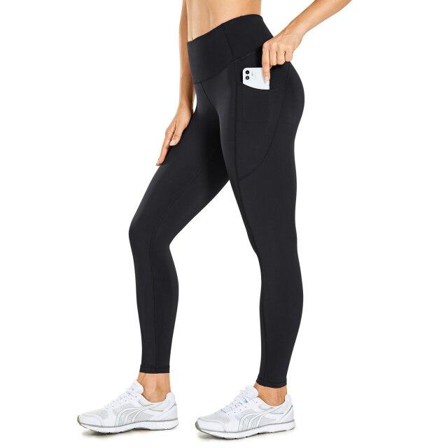 Women's Hugged Feeling Training Leggings in black, featuring a compression fit, tummy control, and pockets for convenience.