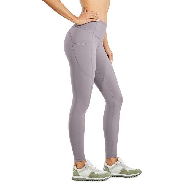 Women's Hugged Feeling Training Leggings in black, featuring a compression fit, tummy control, and pockets for convenience.