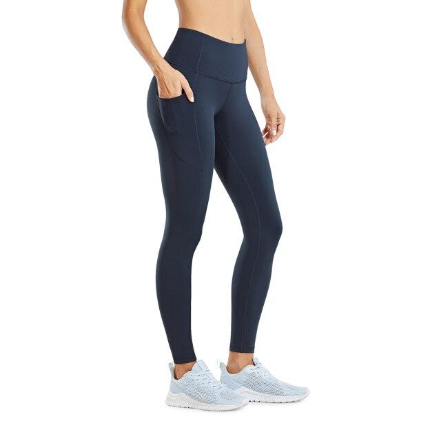 Women's Hugged Feeling Training Leggings in black, featuring a compression fit, tummy control, and pockets for convenience.