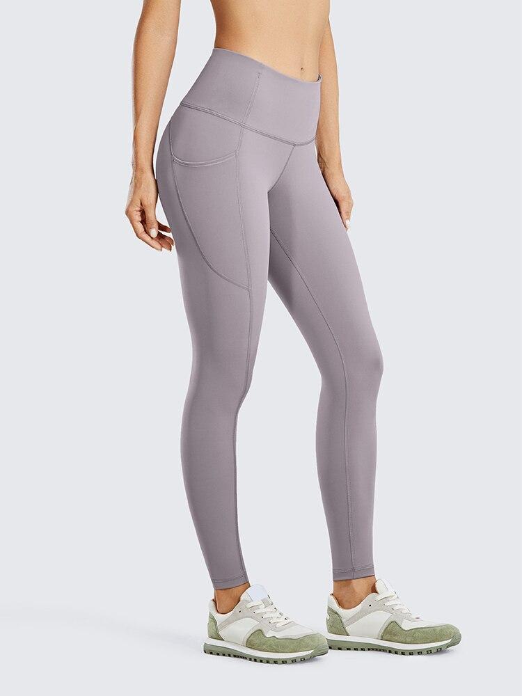 Women's Hugged Feeling Training Leggings in black, featuring a compression fit, tummy control, and pockets for convenience.