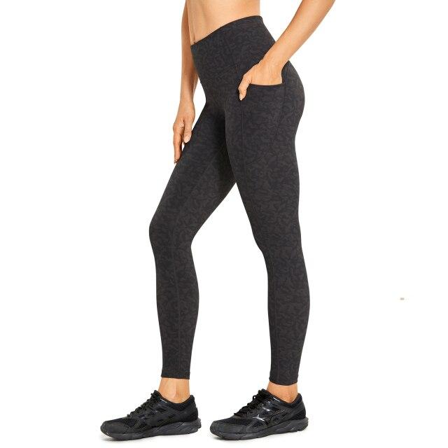 Women's Hugged Feeling Training Leggings in black, featuring a compression fit, tummy control, and pockets for convenience.