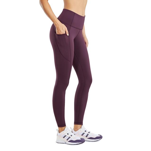 Women's Hugged Feeling Training Leggings in black, featuring a compression fit, tummy control, and pockets for convenience.