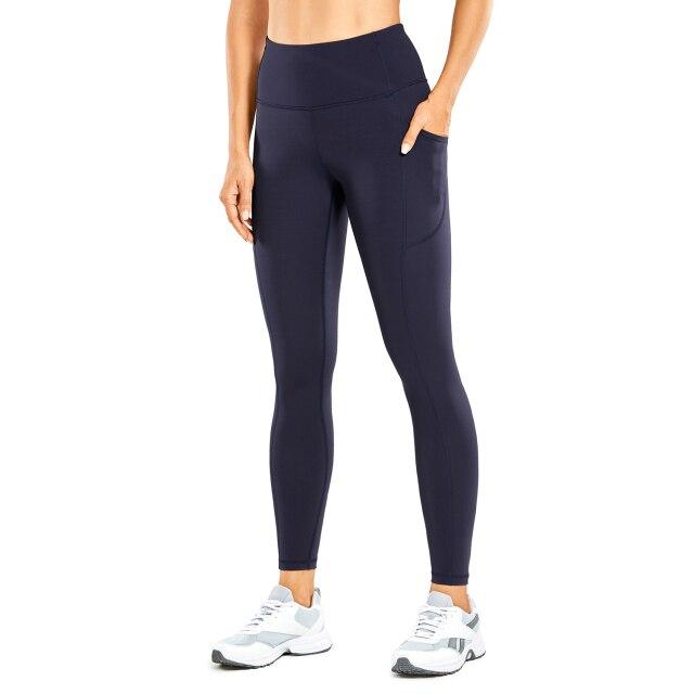 Women's Hugged Feeling Training Leggings in black, featuring a compression fit, tummy control, and pockets for convenience.