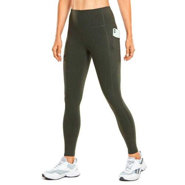 Women's Hugged Feeling Training Leggings in black, featuring a compression fit, tummy control, and pockets for convenience.