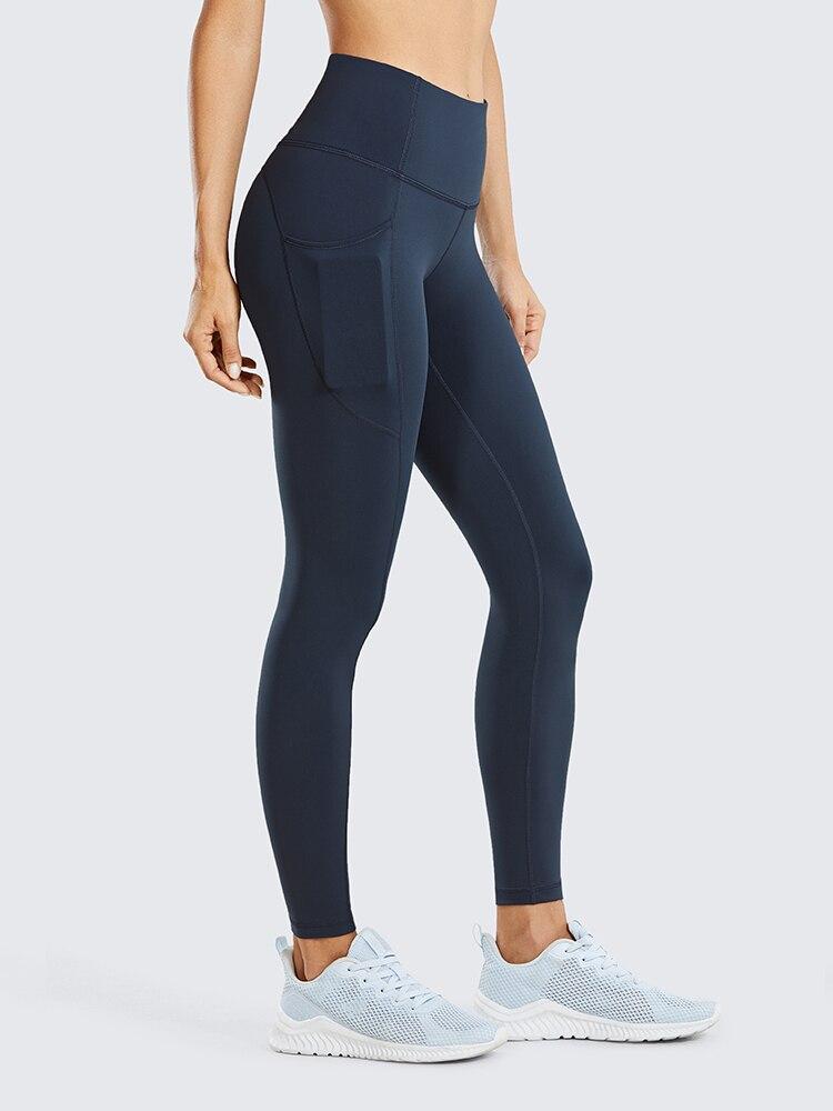 Women's Hugged Feeling Training Leggings in black, featuring a compression fit, tummy control, and pockets for convenience.