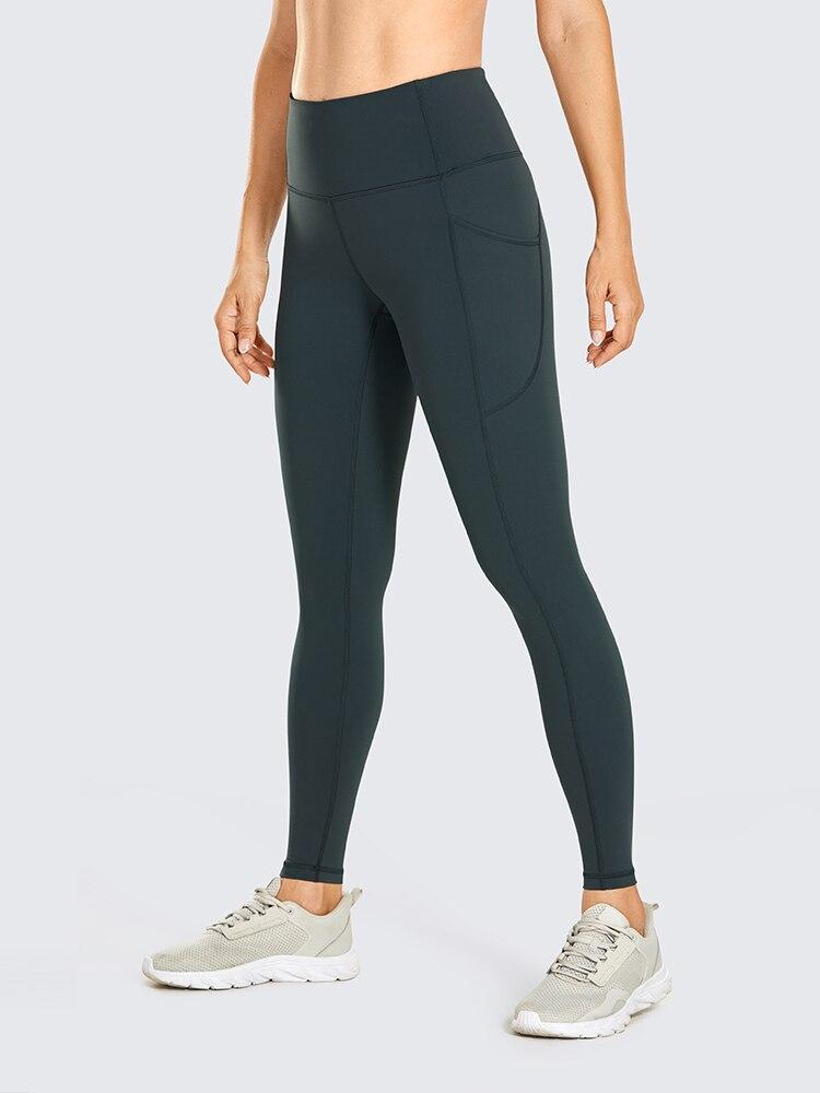 Women's Hugged Feeling Training Leggings in black, featuring a compression fit, tummy control, and pockets for convenience.