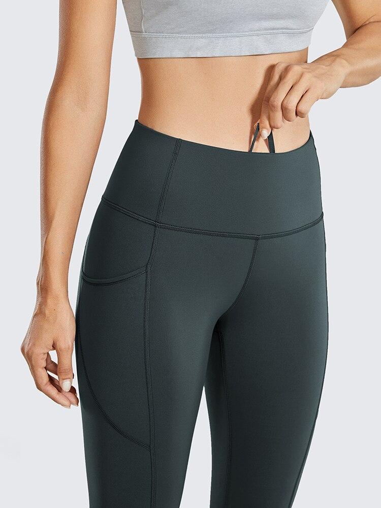 Women's Hugged Feeling Training Leggings in black, featuring a compression fit, tummy control, and pockets for convenience.