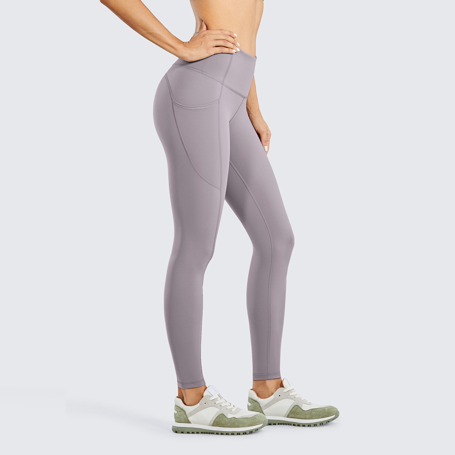 Women's Hugged Feeling Training Leggings in black, featuring a compression fit, tummy control, and pockets for convenience.