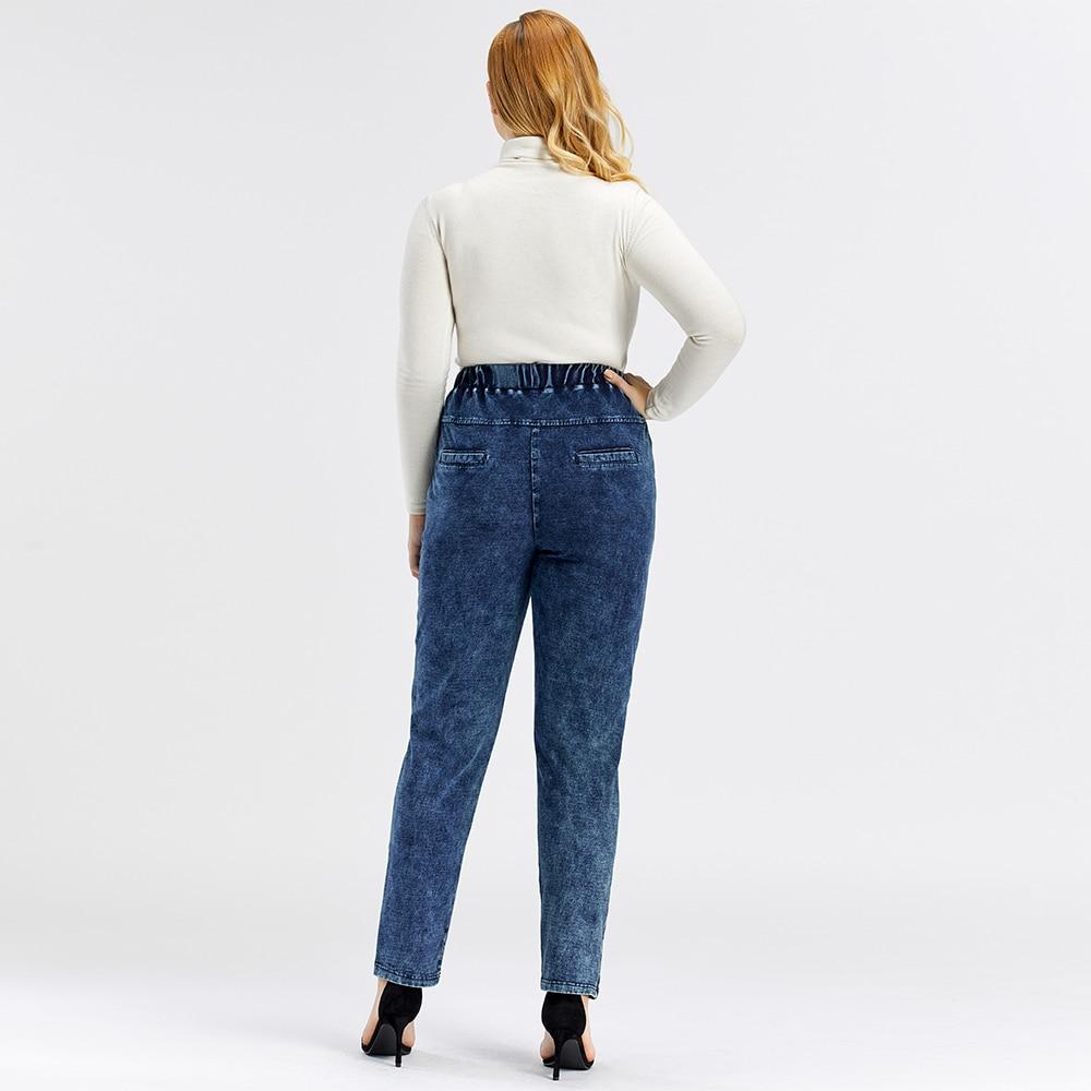 A pair of Women's Plus Size Casual Jeans featuring a mid-rise waist, full-length straight cut, and decorative sashes with lace-up details.