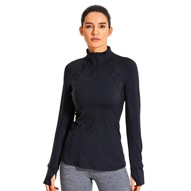 Women's long sleeve athletic workout shirt with quarter-zip design, perfect for running and yoga, made from breathable polyester blend.