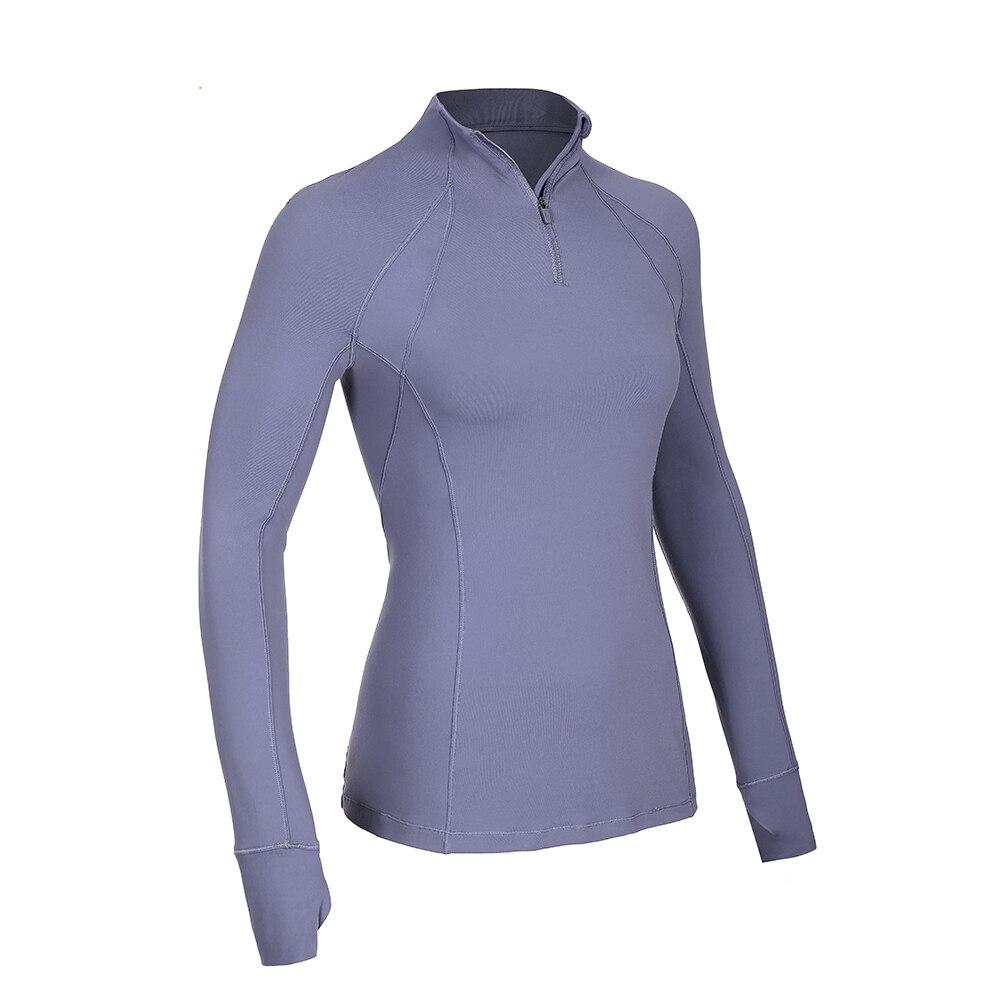 Women's long sleeve athletic workout shirt with quarter-zip design, perfect for running and yoga, made from breathable polyester blend.