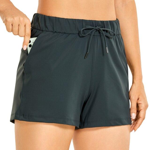 Women's Stretch Lightweight Athletic Shorts featuring an elastic waist and drawstring, perfect for workouts and travel, with pockets for convenience.