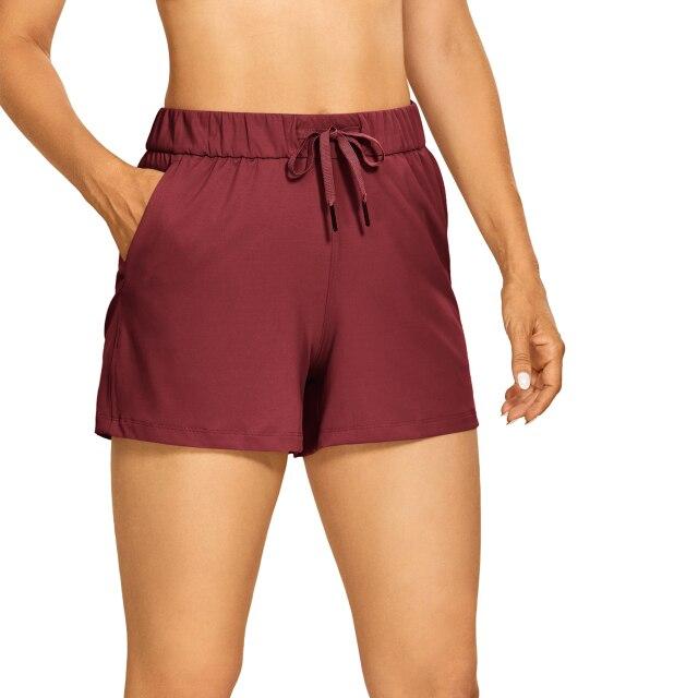 Women's Stretch Lightweight Athletic Shorts featuring an elastic waist and drawstring, perfect for workouts and travel, with pockets for convenience.