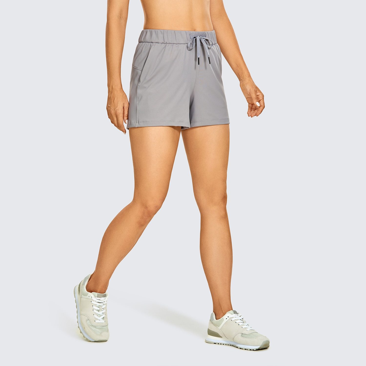 Women's Stretch Lightweight Athletic Shorts featuring an elastic waist and drawstring, perfect for workouts and travel, with pockets for convenience.