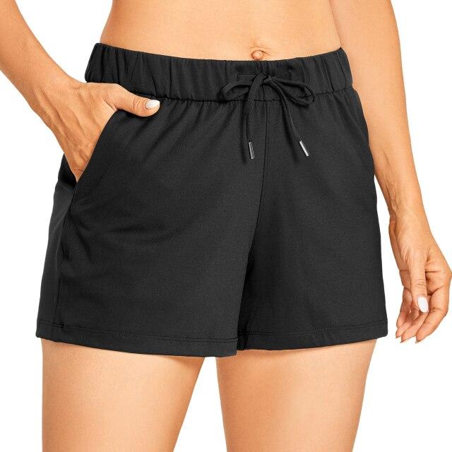 Women's Stretch Lightweight Athletic Shorts featuring an elastic waist and drawstring, perfect for workouts and travel, with pockets for convenience.