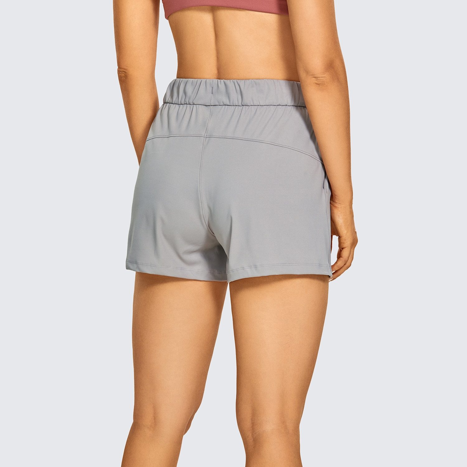 Women's Stretch Lightweight Athletic Shorts featuring an elastic waist and drawstring, perfect for workouts and travel, with pockets for convenience.