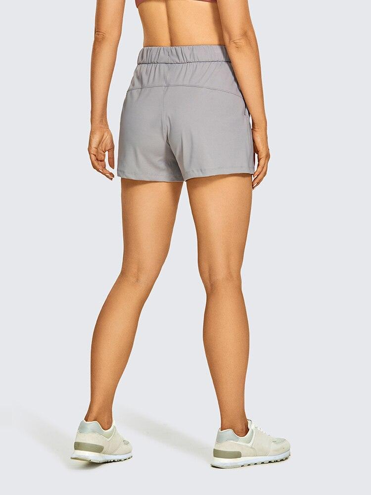 Women's Stretch Lightweight Athletic Shorts featuring an elastic waist and drawstring, perfect for workouts and travel, with pockets for convenience.