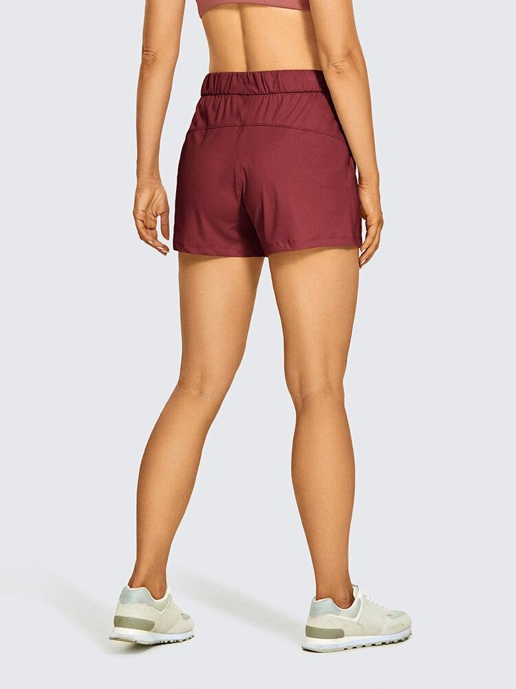 Women's Stretch Lightweight Athletic Shorts featuring an elastic waist and drawstring, perfect for workouts and travel, with pockets for convenience.