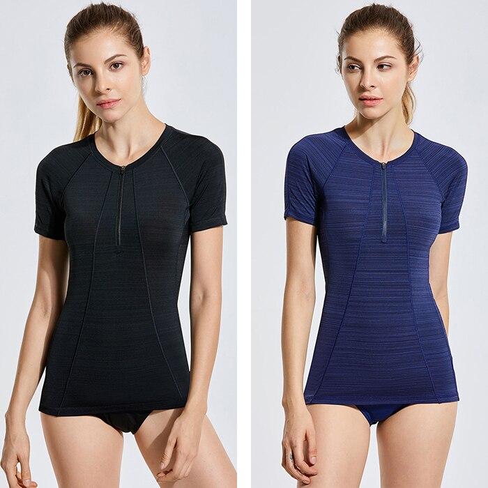 Women's UPF 50+ Zipper Front Rash Guard Swim Shirt in black, showcasing short sleeves and a stylish zipper front design.