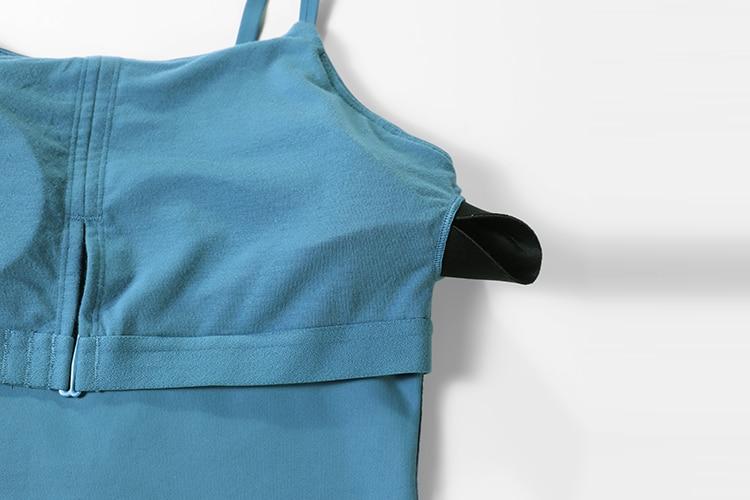 A stylish women's workout tank top featuring adjustable spaghetti straps and a built-in bra, perfect for yoga and athletic activities.